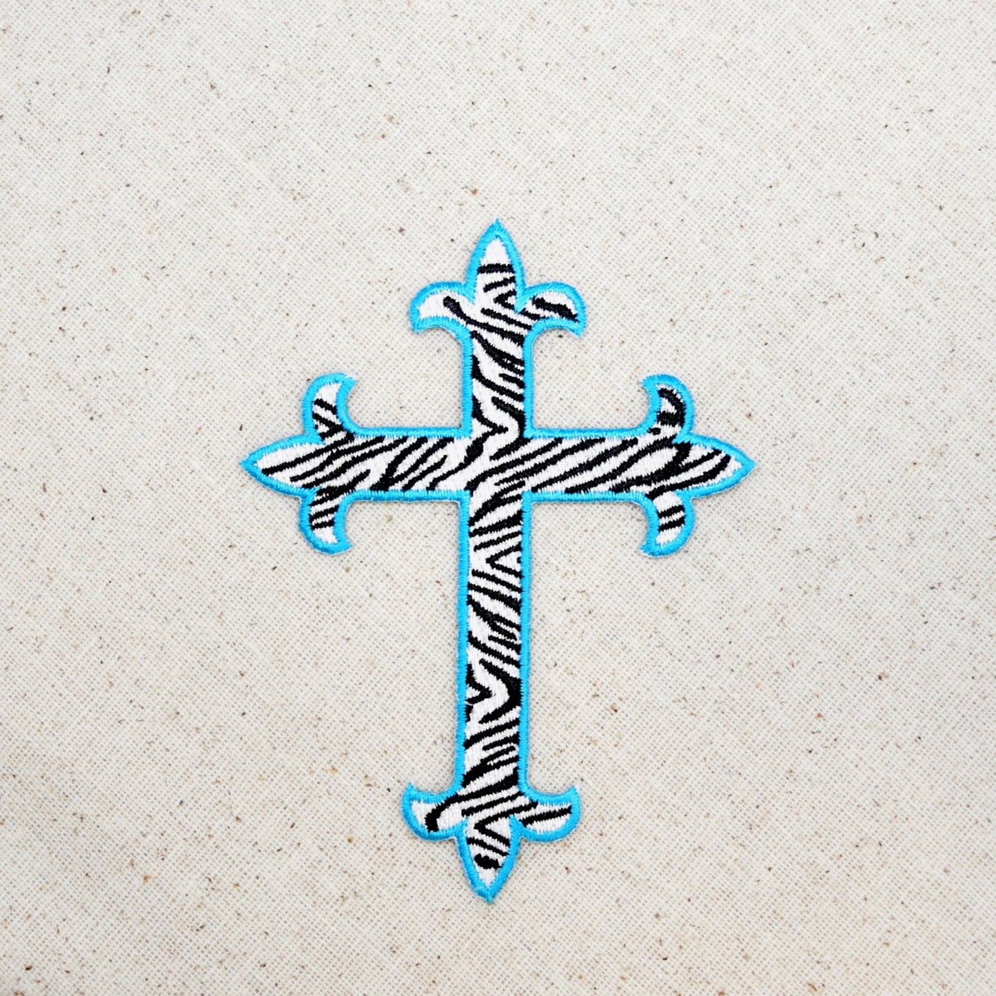 CLEARANCE - Fleur De Lis - Religious Cross - Zebra with Turquoise Blue Outline - 4" - Embroidered Patch - Iron on Applique - WA023